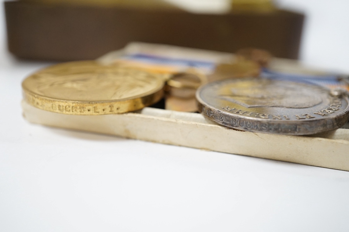 A posthumous First World War medal trio awarded to PTE. R. Holmes Oxf. & Bucks. L.I., together with the issuing letter, the remains of the original card box and a Princess Mary Christmas tin. Condition - fair.